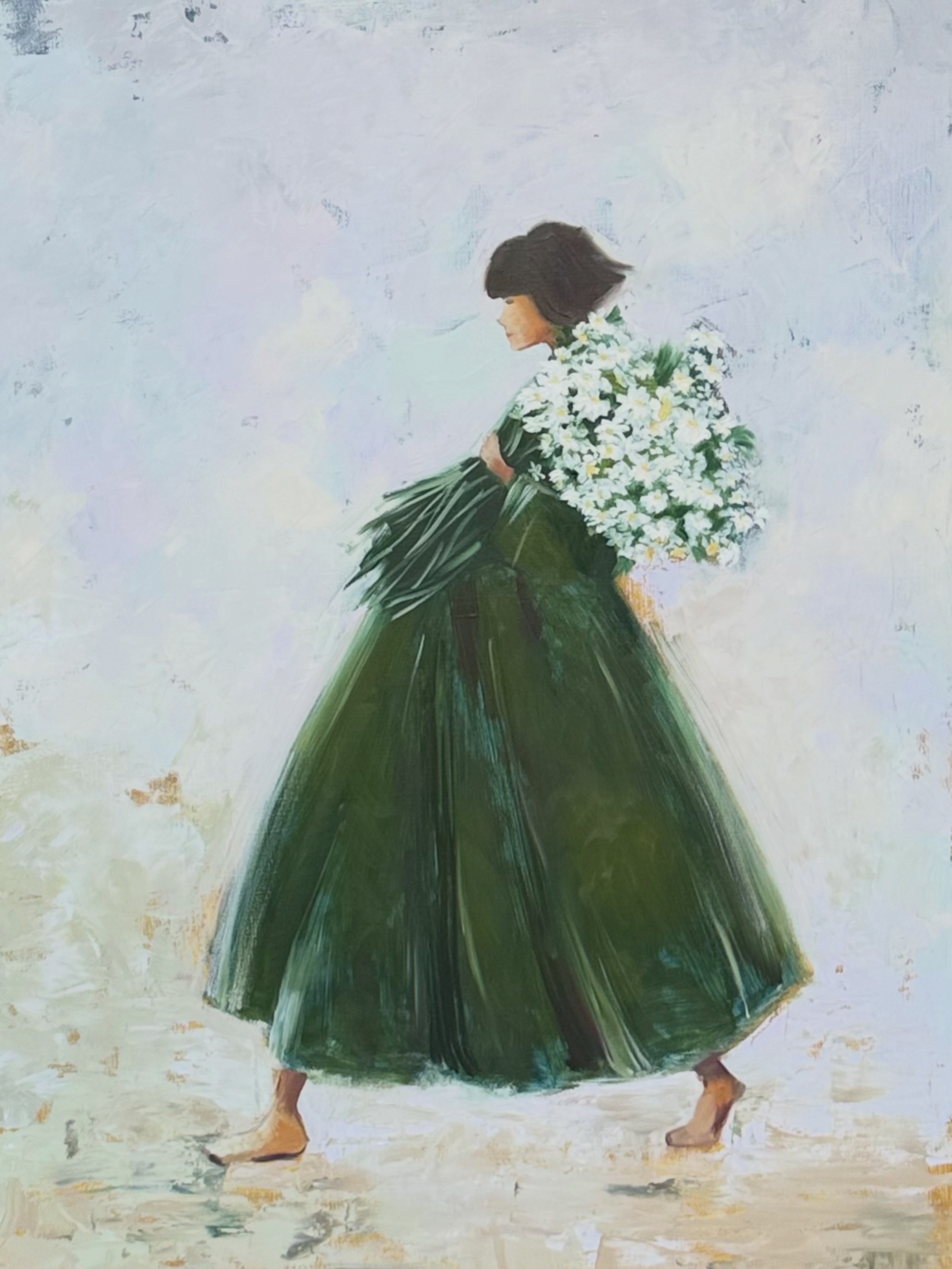 A woman in a dark green dress holding a large white bouquet